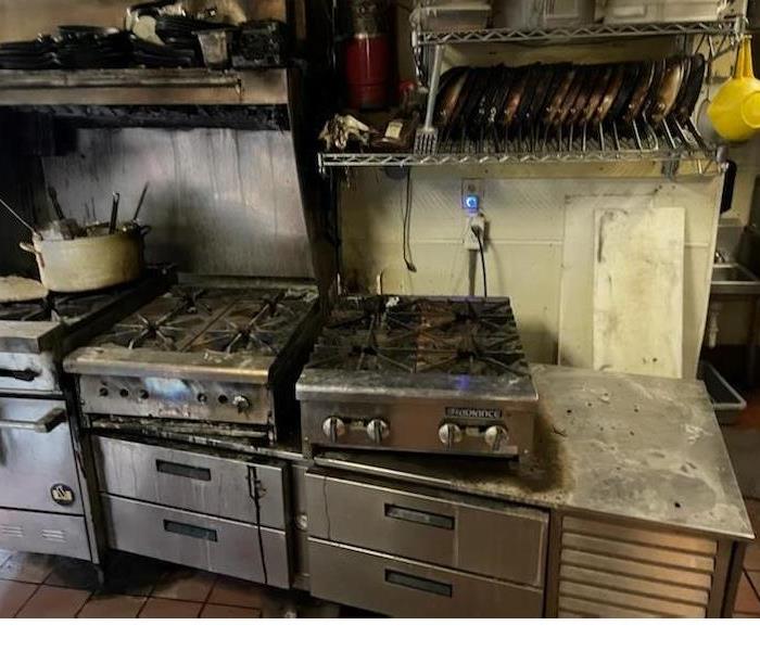 The before image shows the kitchen in a local Italian restaurant after a fire